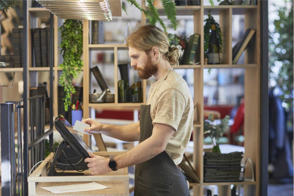 bearded man using cash register in cafe 2021 09 24 04 17 21 utc 50